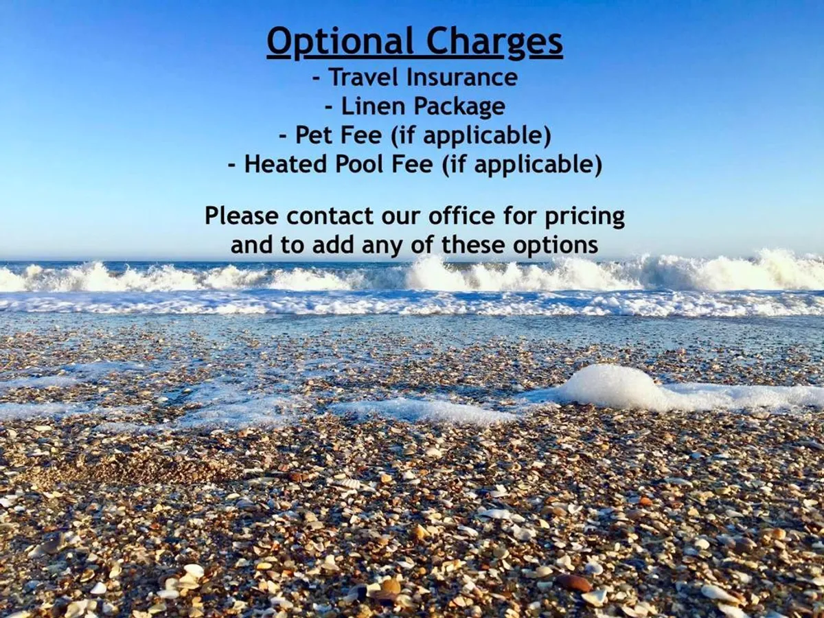 A relaxing, close-up view of the gentle waves breaking on the beach, dotted with shells and soft sand. The inviting shoreline is ideal for families to build sandcastles, hunt for seashells, or simply bask in the sun.